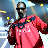 Snoop Dogg Takes On Manchester United's Rio Ferdinand At Football