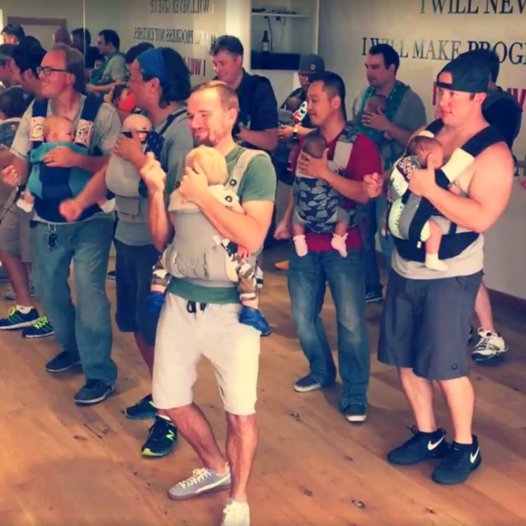 Hilarious viral video emerges of baby-wearing Dads dancing