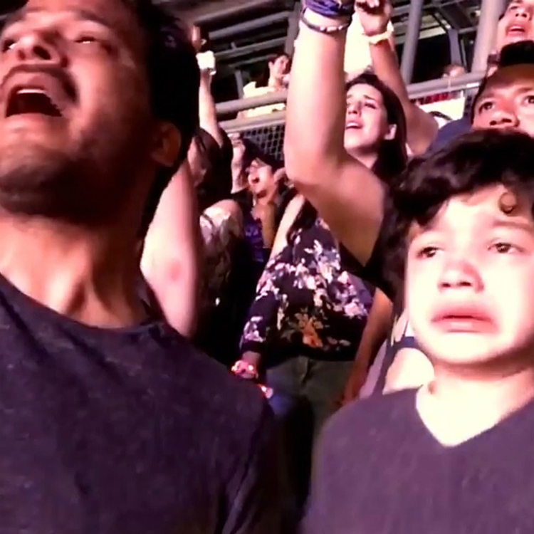 Young autistic boy is overcome with emotion during coldplay concert