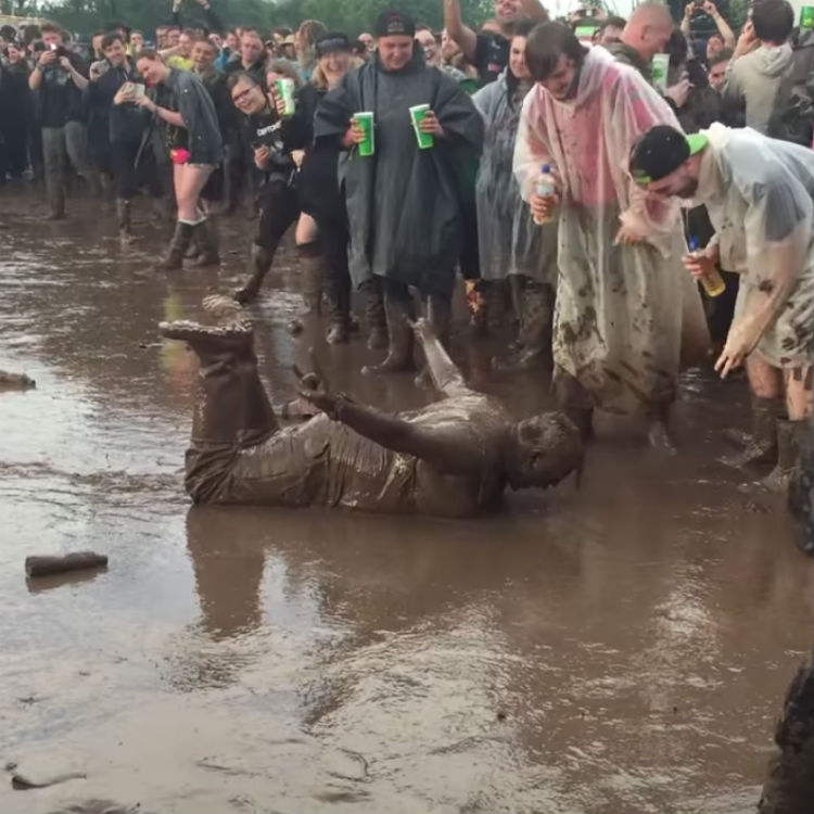 Download Festival bad weather, mud, man dives headfirst video