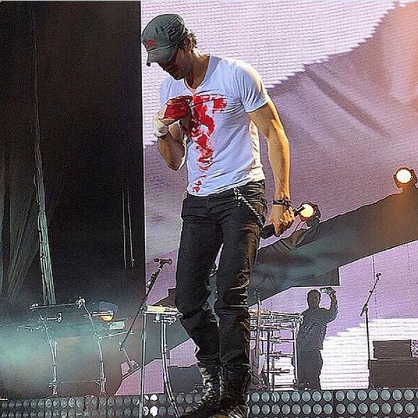 Enrique Iglesias cuts hand open on drone during gig - video