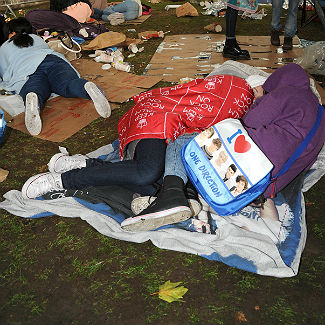 One Direction sleep rough in Central London for glimpse of boyband