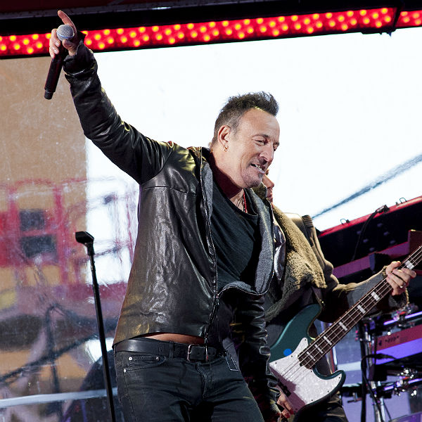 Bruce Spingsteen and U2 perform in Time Square for HIV benefit