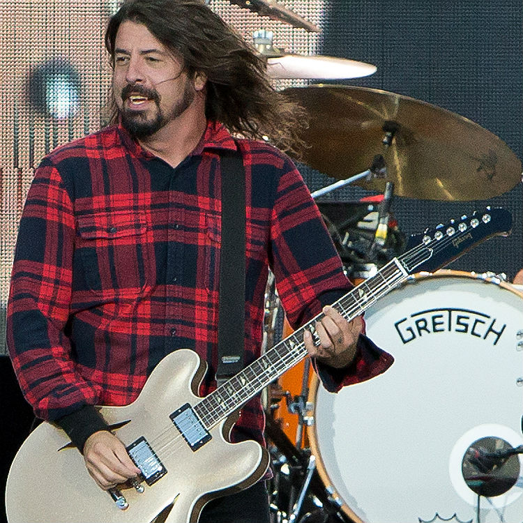 Foo Fighters Dave Grohl plays guitar solo using broken leg - watch