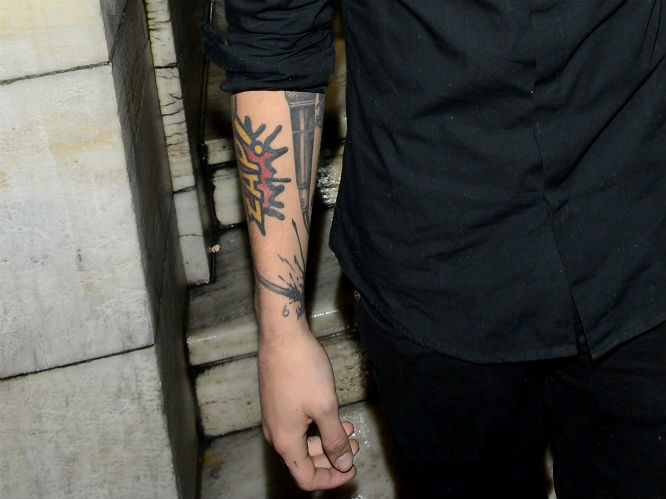 Zayn Malik: Anything Bieber can do - One Direction can (and will) bigger, better and slightly sloppier. The boyband singer was seen sporting new ink during a night out on 28 October 2012. What do you think?