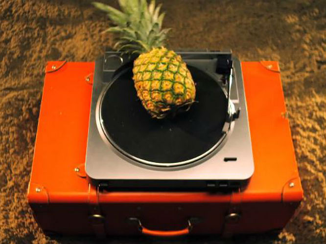 This symbolism which clearly isn't just a pineapple on a turntable...